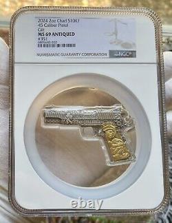 2024 Chad 2oz Silver Coin. 45 Caliber 1911 Pistol Handgun Shaped Gilded NGC MS69